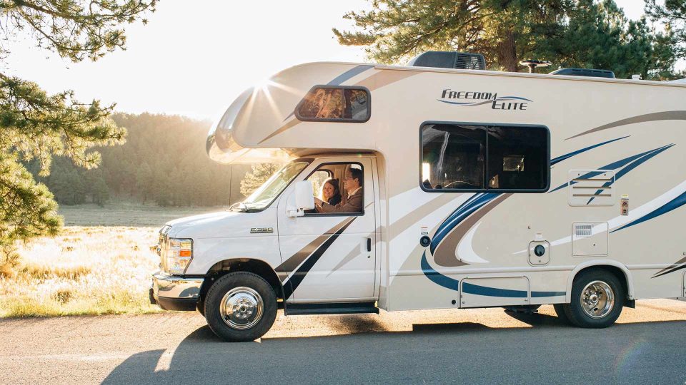 Couple driving RV